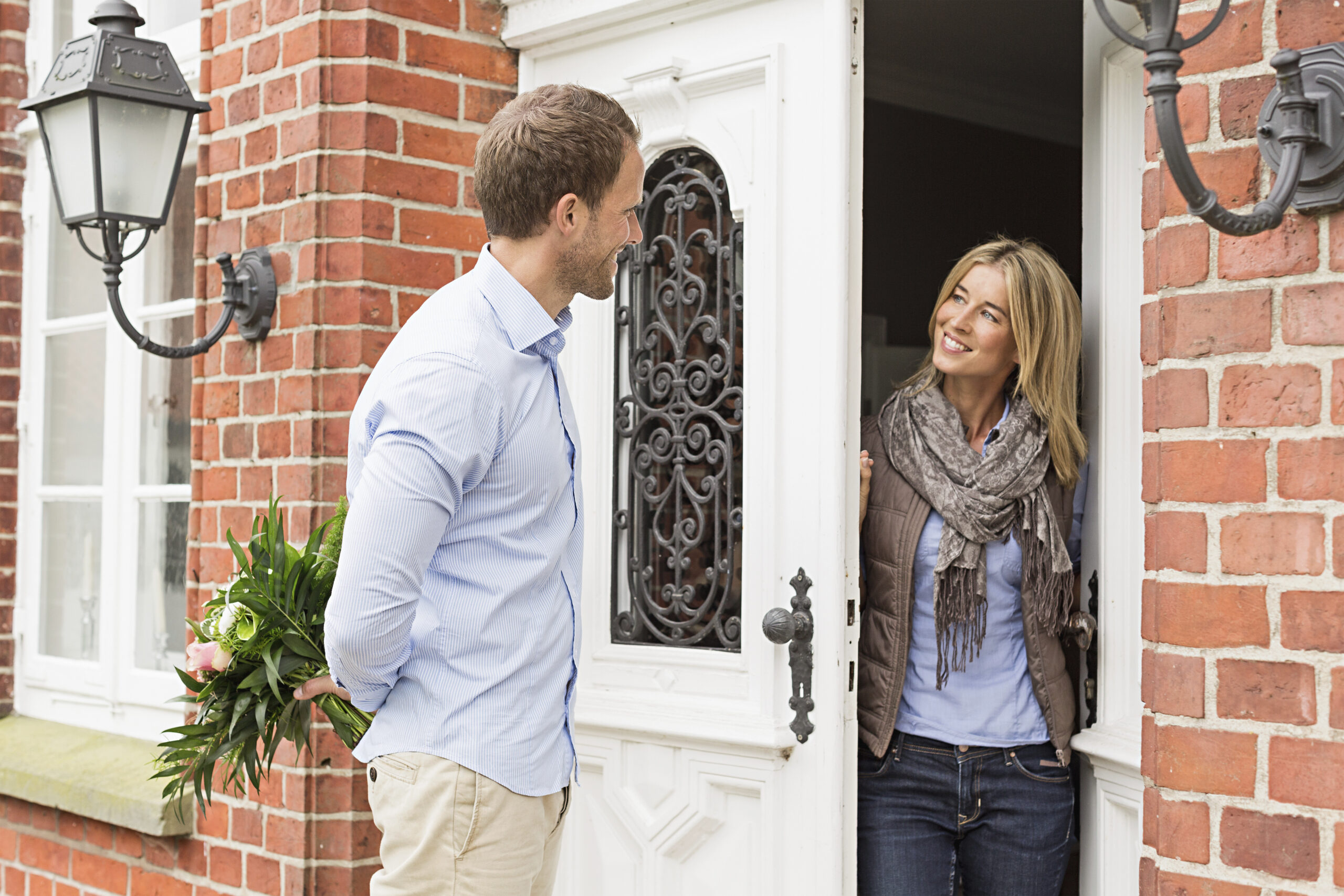 A door-to-door salesperson entertaining a homeowner