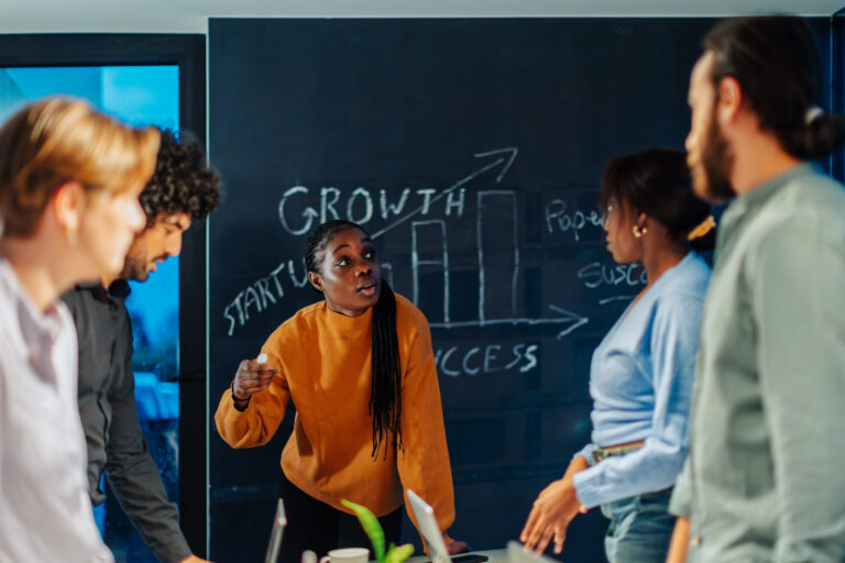 An on-the-ground sales team discussing growth opportunities